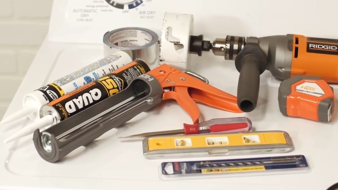 outils installer tuyau sécheuse